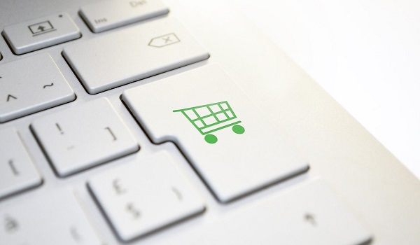 Imágen de un teclado y un carrito de la compra para compra online. Preguntas Frecuentes - Glasdon.